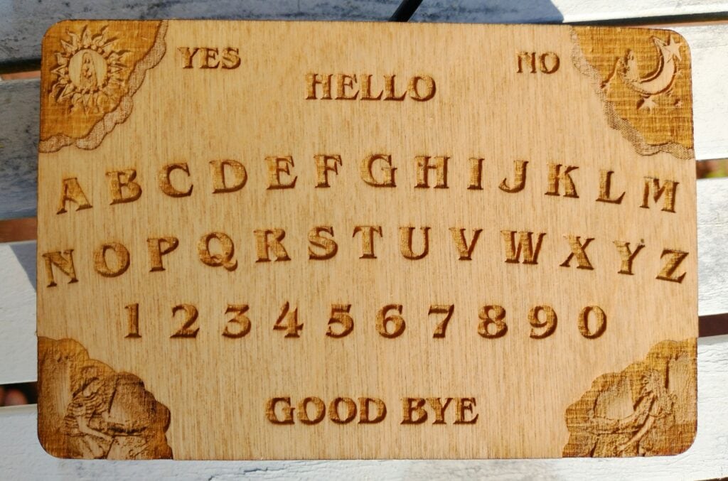 A detailed view of the spirit board surface, which is laser engraved and hand-finished.